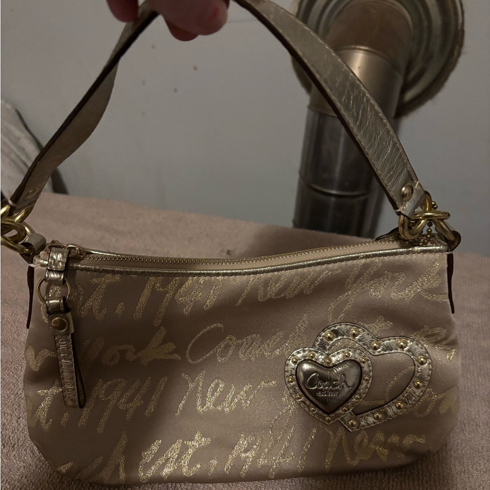 Coach Gold and Cream Wristlet with Heart Detail
